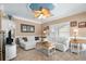 Cozy living room with ceiling fan, white sofas, and natural light, creating an inviting atmosphere at 6001 - 8022 S Kings Hwy., Myrtle Beach, SC 29575