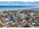 Charming coastal community aerial view featuring a beach, waterfront homes, and beautiful blue skies at 6001 - N84 S Kings Hwy., Myrtle Beach, SC 29575