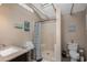 Bathroom with a skylight, walk-in shower, and decorative wall hangings at 6001 - N84 S Kings Hwy., Myrtle Beach, SC 29575