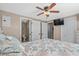 Bedroom with a ceiling fan, television, and private entrance to the bathroom at 6001 - N84 S Kings Hwy., Myrtle Beach, SC 29575
