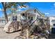 Charming one-story home with a large front porch and wooden stairs at 6001 - N84 S Kings Hwy., Myrtle Beach, SC 29575