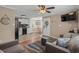 Cozy living room features neutral walls and a ceiling fan that connect with the dining area and kitchen at 6001 - N84 S Kings Hwy., Myrtle Beach, SC 29575
