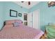 Well-lit bedroom with warm colors, ceiling fan and cozy furnishings at 6001-O32 S Kings Hwy., Myrtle Beach, SC 29575