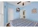 Comfortable blue bedroom with beach theme, ceiling fan and television at 6001-O32 S Kings Hwy., Myrtle Beach, SC 29575