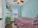 Bright bedroom with ceiling fan, window, and comfortable bed at 6001-O32 S Kings Hwy., Myrtle Beach, SC 29575