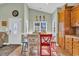 Cozy breakfast nook features bright, colorful seating and ample natural light from surrounding windows at 6001-O32 S Kings Hwy., Myrtle Beach, SC 29575