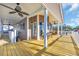 Spacious deck with ceiling fans, offering ample seating and shade, perfect for outdoor enjoyment at 6001-O32 S Kings Hwy., Myrtle Beach, SC 29575