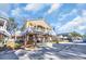 Beautiful two-story home on pilings with a charming porch, surrounded by well-maintained lawns at 6001-O32 S Kings Hwy., Myrtle Beach, SC 29575
