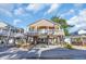 Charming two-story beach home on pilings, showcasing a welcoming porch and well-maintained landscaping at 6001-O32 S Kings Hwy., Myrtle Beach, SC 29575