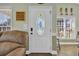 Entryway featuring an elegant door with decorative glass, complemented by cozy furnishings and a welcoming ambiance at 6001-O32 S Kings Hwy., Myrtle Beach, SC 29575