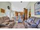Relaxing living room features plush seating, and easy access to the kitchen and front entrance at 6001-O32 S Kings Hwy., Myrtle Beach, SC 29575