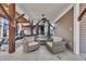 Cozy covered outdoor living area with comfortable seating, ceiling fan, and stylish decor at 6001-O32 S Kings Hwy., Myrtle Beach, SC 29575