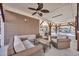 Charming outdoor living space with wicker furniture and a functional ceiling fan and lots of shade at 6001-O32 S Kings Hwy., Myrtle Beach, SC 29575