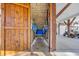 Spacious covered outdoor shower area with a convenient bench and hanging racks for beach gear storage at 6001-O32 S Kings Hwy., Myrtle Beach, SC 29575