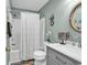 Charming bathroom featuring a shower-tub combo, a vanity with ample storage, and coastal-themed decor at 602 Waterway Village Blvd. # 30-F, Myrtle Beach, SC 29579