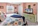 Bedroom with nautical decor, large window, closet, and dresser with TV at 602 Waterway Village Blvd. # 30-F, Myrtle Beach, SC 29579