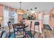 Inviting dining area with a table, chairs, and view to the kitchen with ample lighting at 602 Waterway Village Blvd. # 30-F, Myrtle Beach, SC 29579