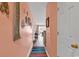 Inviting hallway with beach-themed decor and a peek into the sunlit living area at 602 Waterway Village Blvd. # 30-F, Myrtle Beach, SC 29579