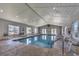 Inviting indoor pool area with natural lighting, comfortable seating, and pristine blue water at 602 Waterway Village Blvd. # 30-F, Myrtle Beach, SC 29579