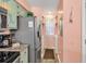 Functional kitchen with stainless steel refrigerator and adjacent laundry nook for added convenience at 602 Waterway Village Blvd. # 30-F, Myrtle Beach, SC 29579