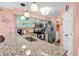 Well-equipped kitchen with stainless steel appliances, granite countertops, and a convenient laundry area at 602 Waterway Village Blvd. # 30-F, Myrtle Beach, SC 29579