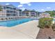 Inviting swimming pool surrounded by lounge chairs and landscaped grounds for relaxation and enjoyment at 602 Waterway Village Blvd. # 30-F, Myrtle Beach, SC 29579
