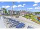 Well-maintained pool area with lounge chairs, picnic tables, and community amenities under a clear sky at 602 Waterway Village Blvd. # 30-F, Myrtle Beach, SC 29579