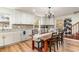 Charming dining room with white cabinetry, granite countertops, and a rustic dining table at 613 Calhoun Dr., Murrells Inlet, SC 29576