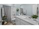 Bright bathroom with a double sink vanity, shower-tub combo, and fresh decor at 617 Cherry Blossom Dr., Murrells Inlet, SC 29576