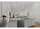 Modern kitchen with granite countertops, stainless steel appliances, and open to the living room at 617 Cherry Blossom Dr., Murrells Inlet, SC 29576
