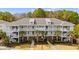 Aerial view of condo buildings with balconies and landscaped grounds and palm trees at 6253 Catalina Dr. # 921, North Myrtle Beach, SC 29582