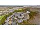 Community aerial showcasing condos around ponds and green spaces with nearby golf course at 6253 Catalina Dr. # 921, North Myrtle Beach, SC 29582