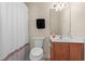 Bathroom with a single sink vanity and shower with patterned curtain at 6253 Catalina Dr. # 921, North Myrtle Beach, SC 29582