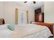 Bedroom featuring a bed with a white comforter, and a television on a cabinet at 6253 Catalina Dr. # 921, North Myrtle Beach, SC 29582