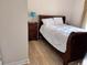 Bedroom with hardwood flooring, a wooden bed frame, and a side table at 6253 Catalina Dr. # 921, North Myrtle Beach, SC 29582