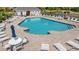 Community pool area featuring ample lounge seating, tables, and a refreshing swimming pool at 6253 Catalina Dr. # 921, North Myrtle Beach, SC 29582