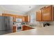 Bright kitchen featuring stainless steel appliances, wooden cabinets, and double basin sink at 6253 Catalina Dr. # 921, North Myrtle Beach, SC 29582
