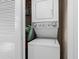 Laundry area featuring a stacked washer and dryer unit in a closet space at 6253 Catalina Dr. # 921, North Myrtle Beach, SC 29582