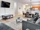 Open living area with dining and kitchen views, hardwood floors and comfortable, modern furnishings at 6253 Catalina Dr. # 921, North Myrtle Beach, SC 29582