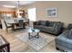 Cozy open-concept living room with modern furniture, adjacent dining area, and laminate flooring at 6253 Catalina Dr. # 921, North Myrtle Beach, SC 29582