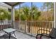Relaxing screened porch with patio furniture and views of palm trees and the surrounding landscape at 6253 Catalina Dr. # 921, North Myrtle Beach, SC 29582
