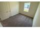Cozy carpeted bedroom featuring a window for natural light and a closet for storage at 627 Castillo Dr., Loris, SC 29569