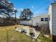 Backyard patio with outdoor seating, set against a backdrop of a grassy lawn and home at 632 Magnolia Dr., Georgetown, SC 29440
