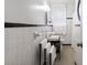 Classic black and white bathroom with tiled walls and patterned tile flooring at 632 Magnolia Dr., Georgetown, SC 29440
