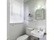 Clean bathroom with a white sink, toilet, and shower with neutral colored walls at 632 Magnolia Dr., Georgetown, SC 29440