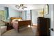 Charming bedroom featuring a wooden bed frame, light blue walls, and hardwood floors at 632 Magnolia Dr., Georgetown, SC 29440