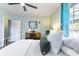 Inviting bedroom with a metal bed frame, light blue walls, and natural light coming through the window at 632 Magnolia Dr., Georgetown, SC 29440