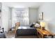 Bright bedroom with neutral walls, plush carpeting, and a large window with sheer curtains at 632 Magnolia Dr., Georgetown, SC 29440