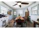 Bright dining room with light blue walls, tile flooring, and a rustic wooden table at 632 Magnolia Dr., Georgetown, SC 29440