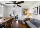 Dining room connected to the living room, featuring hardwood floors and ample natural light at 632 Magnolia Dr., Georgetown, SC 29440